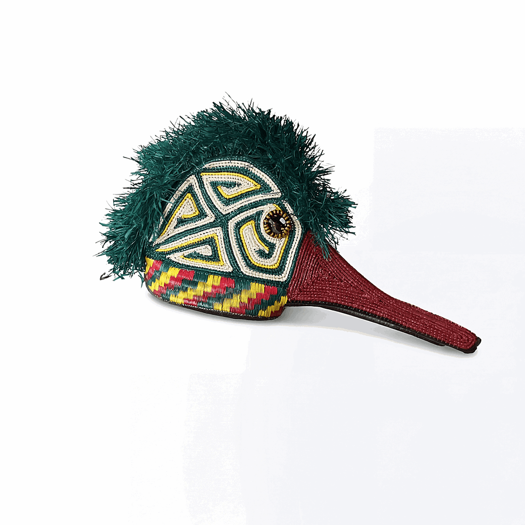 Green hummingbird ceremonial mask with triangle patterns handmade by Embera artisans from Panama