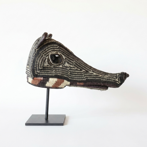 Handwoven Emberá anteater mask with a long snout and dark maze-pattern weave, from Panama
