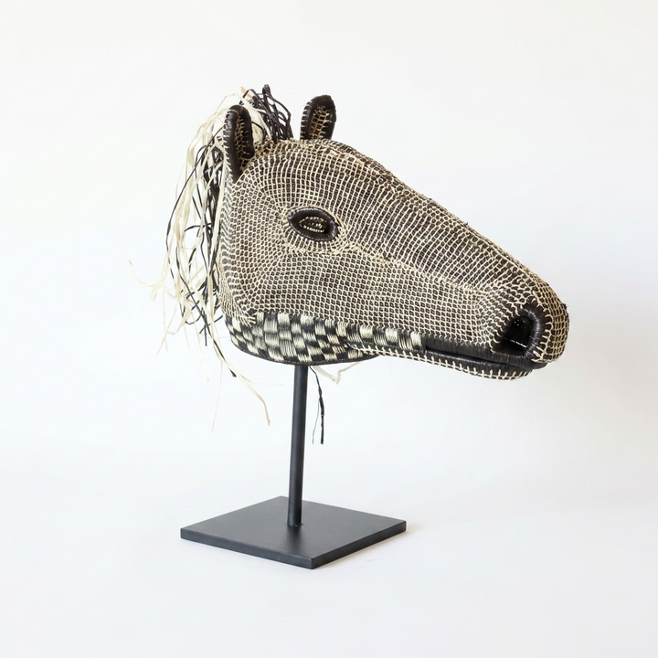 Handwoven Emberá horse mask in brown and ivory with a checkered muzzle and straw mane, from Panama
