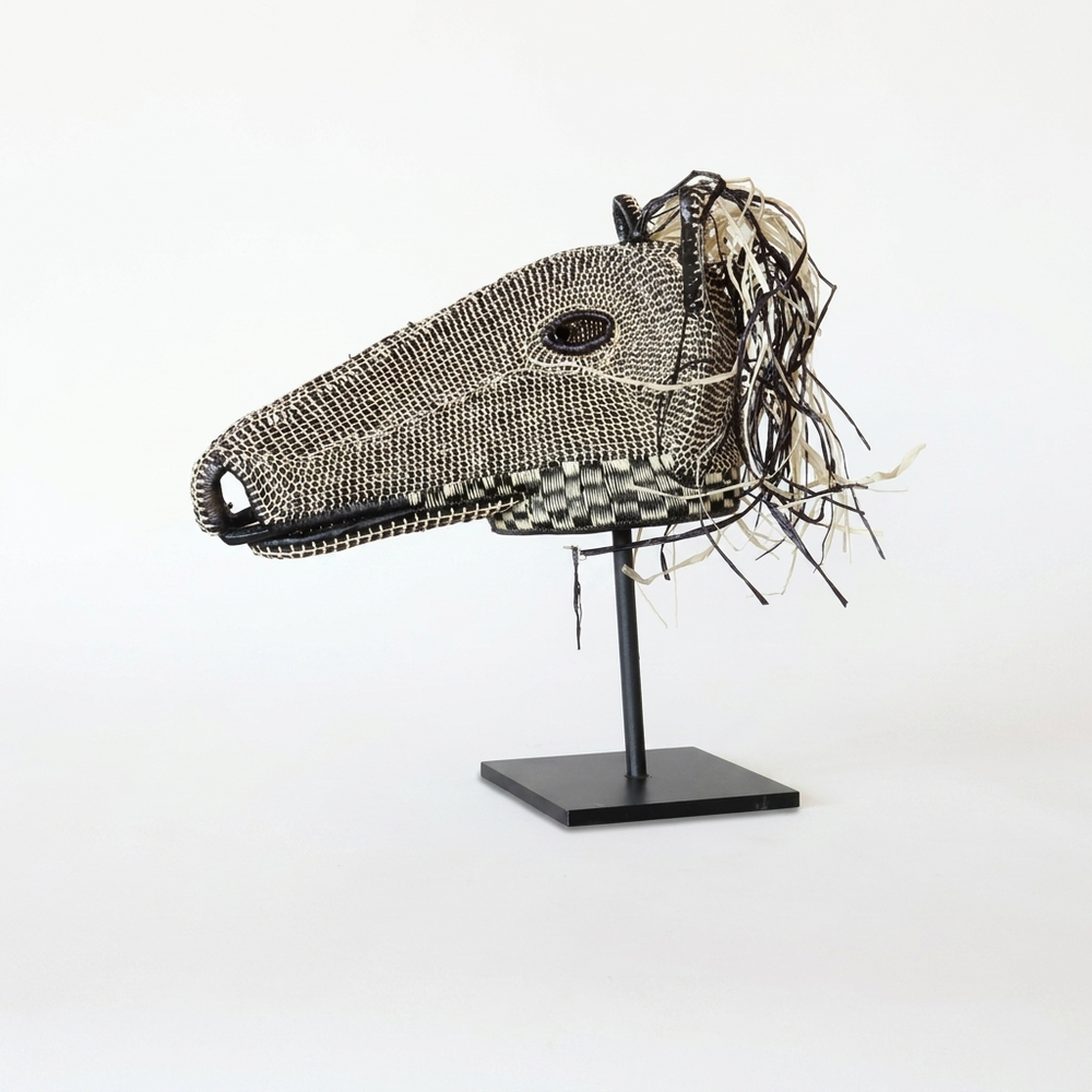 Emberá horse mask alternate view, brown and ivory woven palm fiber, Darién Panama