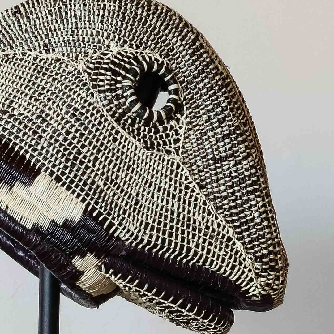 Detail of the mottled weave and ringed eye on an Emberá lizard mask