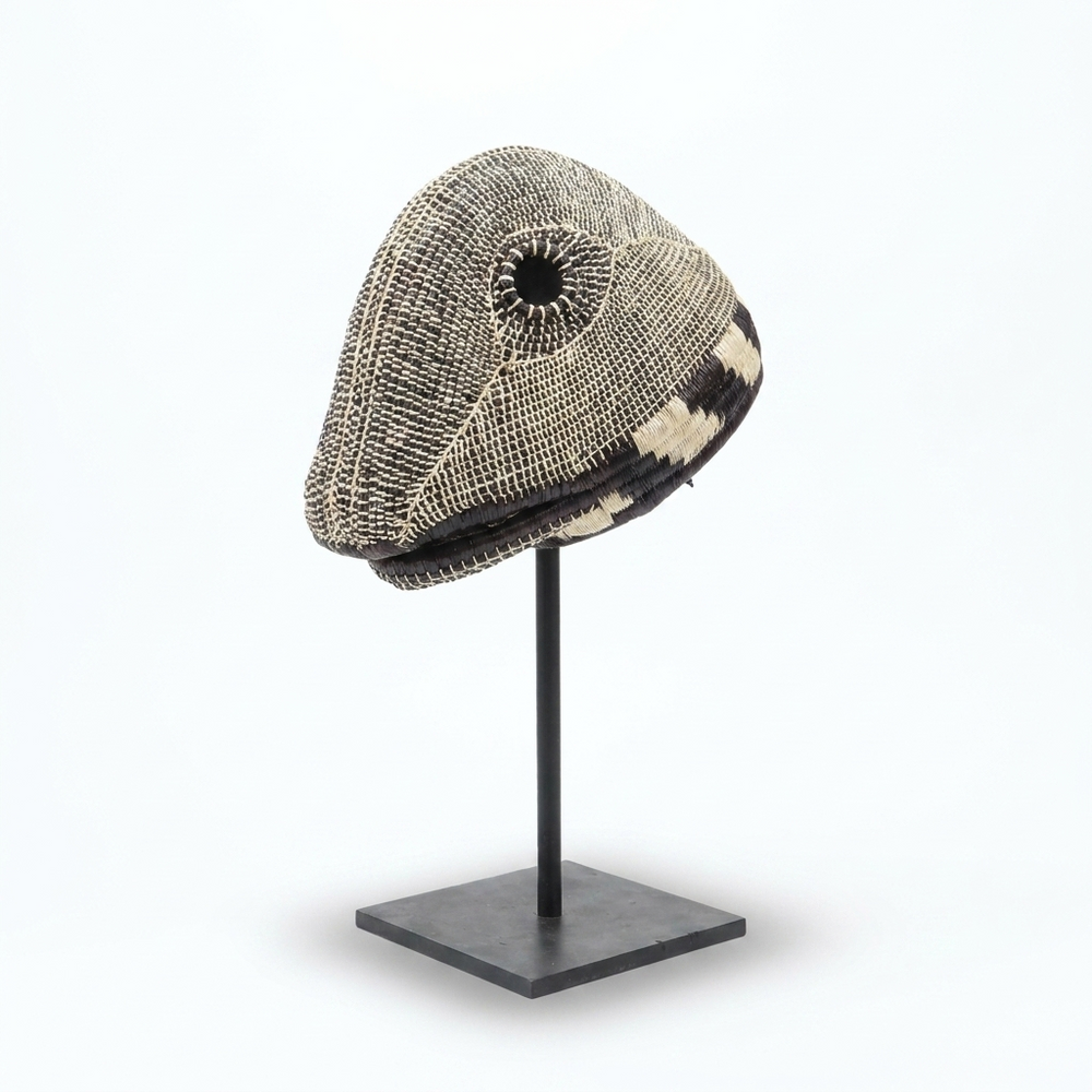 Handwoven Emberá lizard mask in mottled black, grey and ivory palm fiber, from Panama
