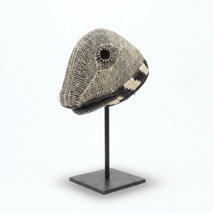 Handwoven Emberá lizard mask in mottled black, grey and ivory palm fiber, from Panama