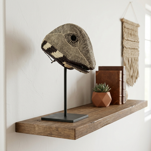 Emberá lizard mask styled as wall art in a room setting