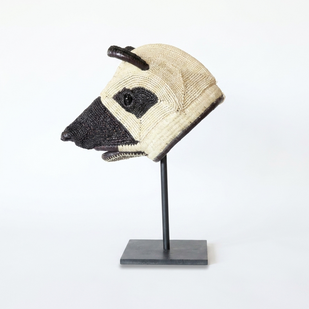 Handwoven Emberá dog mask in black and ivory with upright ears, from Panama