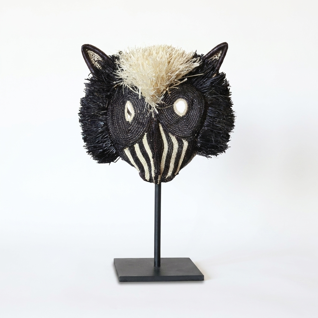 Handwoven Emberá striped cat mask in ivory and black palm fiber, from Panama
