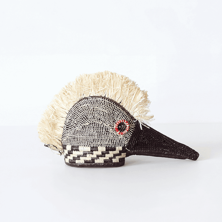 Tiny red-eye hummingbird ceremonial mask handwoven from palm leaves by Embera artisans Panama