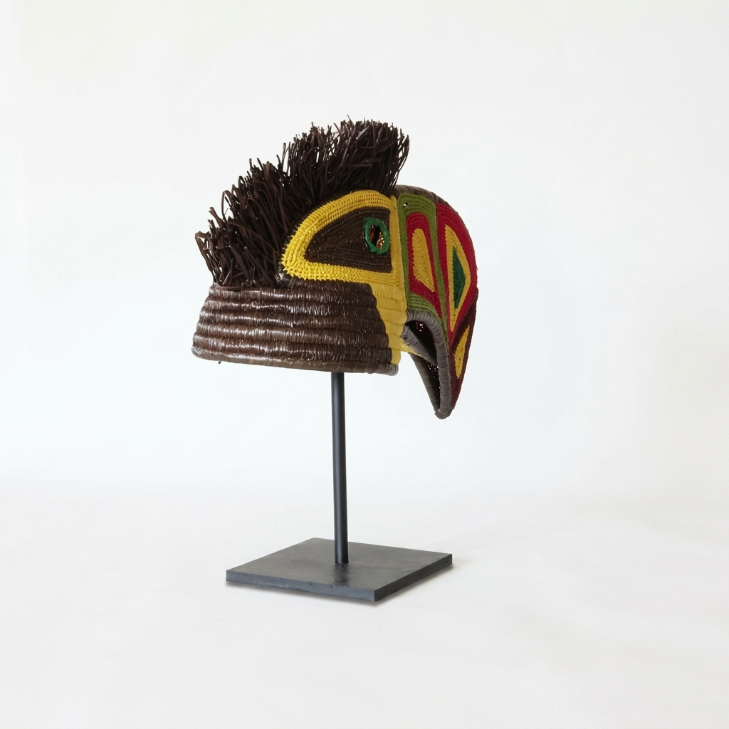 Emberá toucan woven mask alternate view, vivid geometric beak and yellow beaded face, wall art from Panama