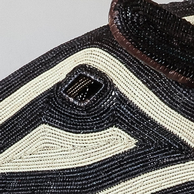 Detail of concentric ivory triangle weave on dark Emberá horse mask