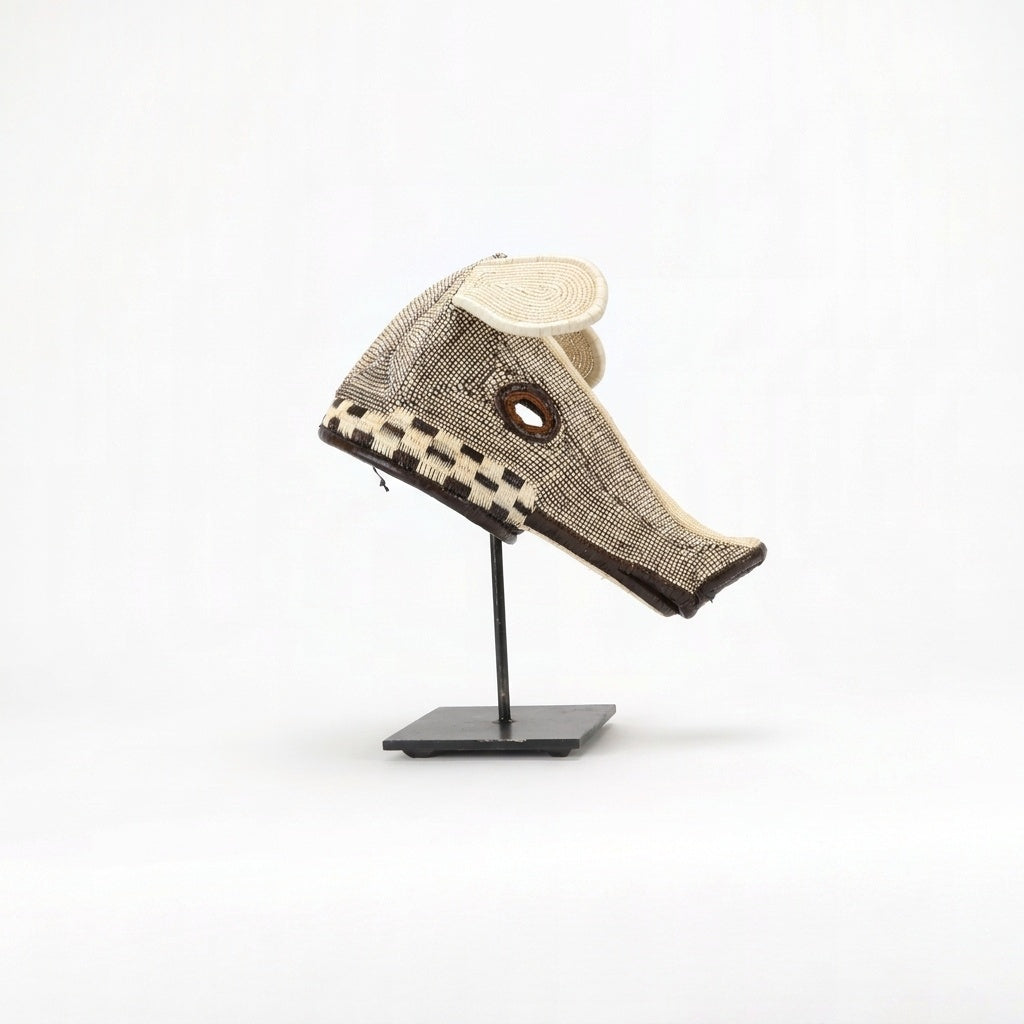 Checkerboard dog mask, alternating brown and cream squares in palm fiber