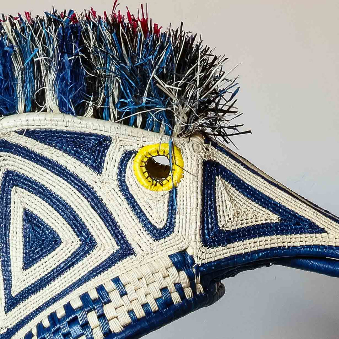 Detail of the cobalt and ivory geometric weave on an Emberá hummingbird mask