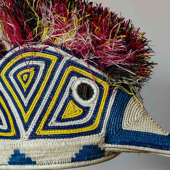 Detail of the ivory, yellow and blue weave on an Emberá hummingbird mask