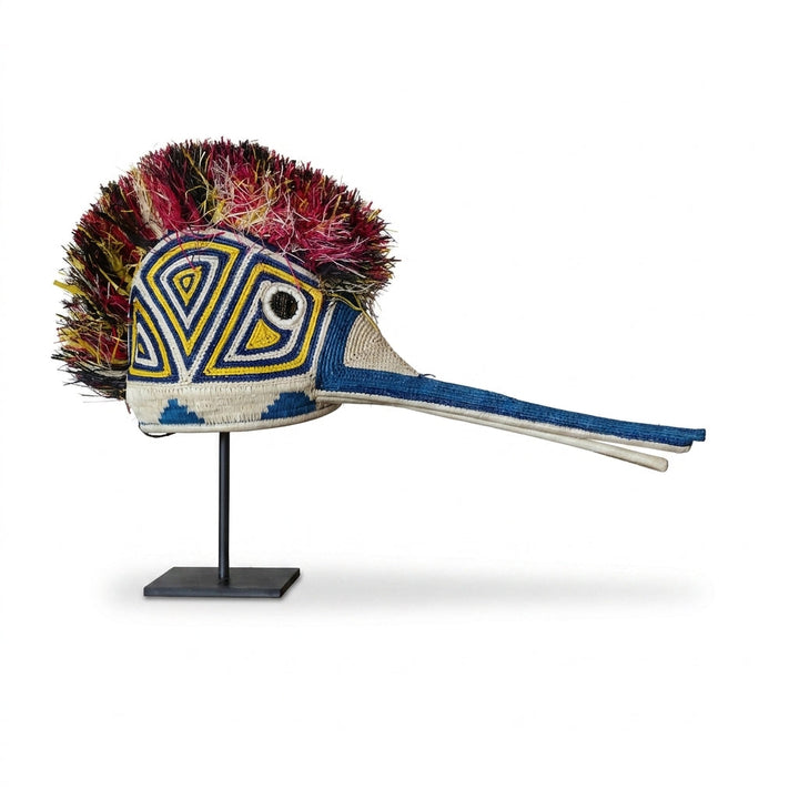 Handwoven Emberá hummingbird mask with a magenta crest and blue beak, from Panama