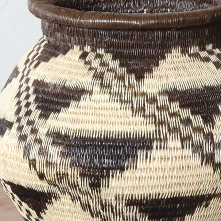 Close-up detail of tight-coil werregue palm weaving showing stepped diamond pattern craftsmanship