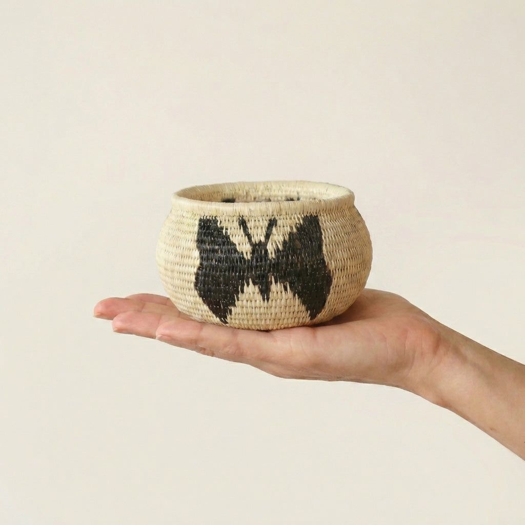 Vintage mini handmade basket with black butterflies motif woven in traditional palm fiber by indigenous artisans