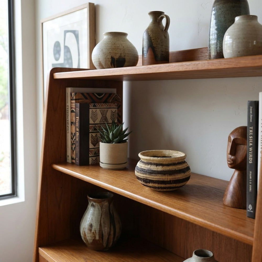 Vintage black stripe mini basket displayed on modern shelf with books and decor