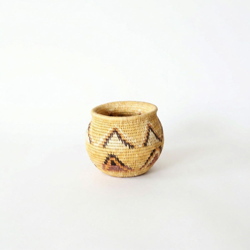 Small handwoven mini basket with yellow triangle pattern by indigenous artisans