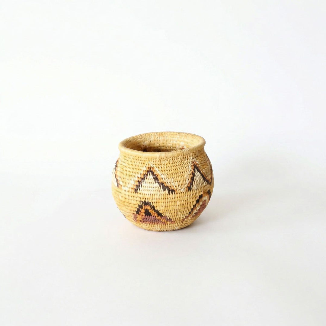 Small handwoven mini basket with yellow triangle pattern by indigenous artisans