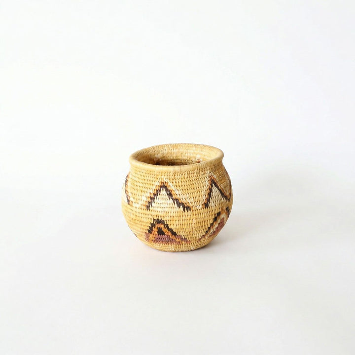 Small handwoven mini basket with yellow triangle pattern by indigenous artisans