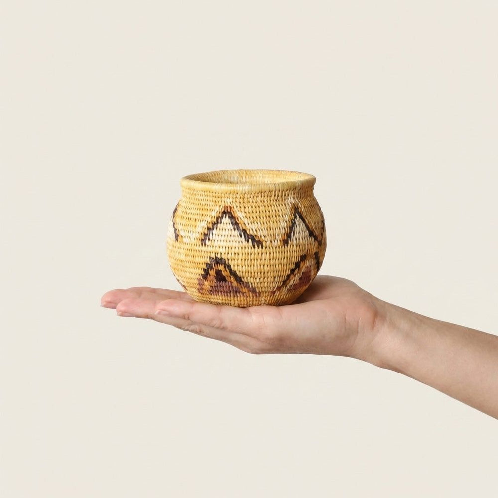 Small handwoven mini basket with yellow triangle pattern by indigenous artisans