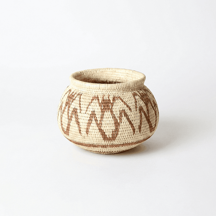 Small vintage brown werregue palm basket with intricate ant motifs by Wounaan artisans from Panama