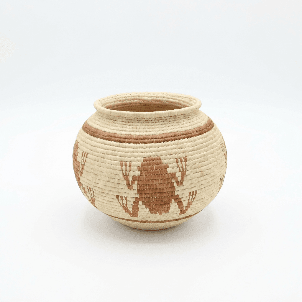 Small brown woven basket with frog motifs by Wounaan artisans from Panama Darién rainforest