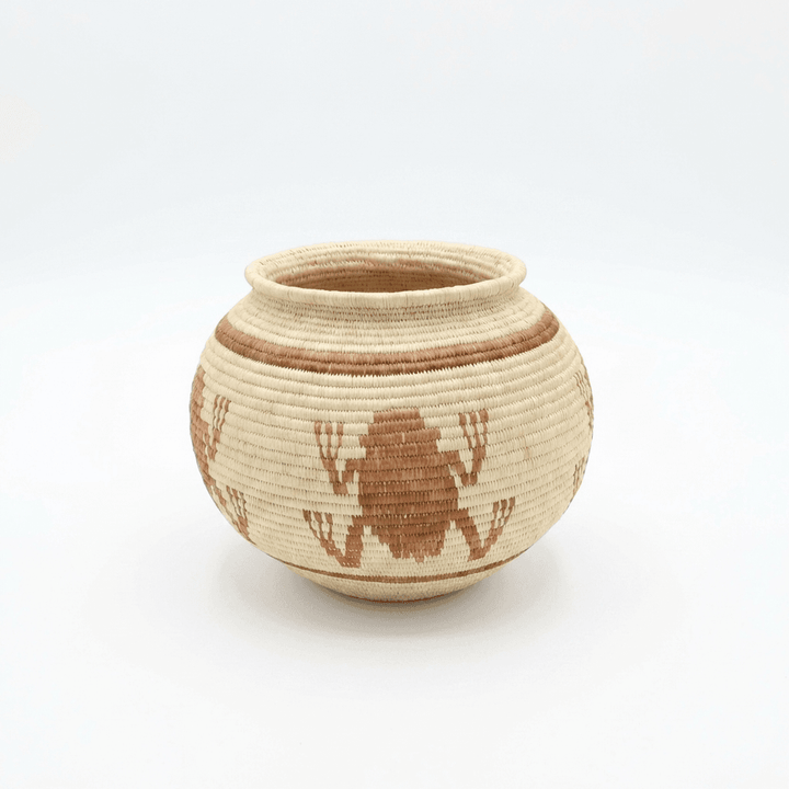 Small brown woven basket with frog motifs by Wounaan artisans from Panama Darién rainforest