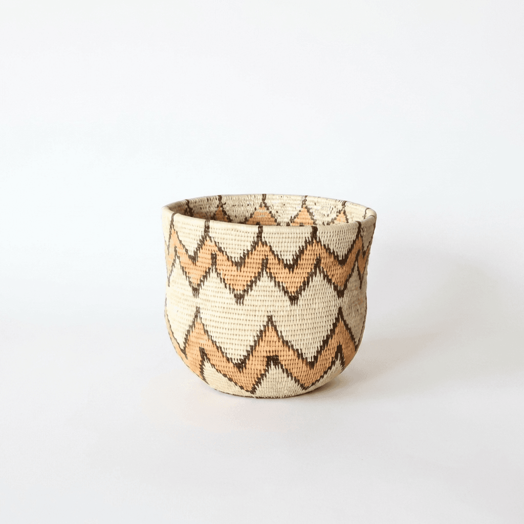 Mini woven bowl basket with orange black zigzag pattern on cream base by indigenous artisans