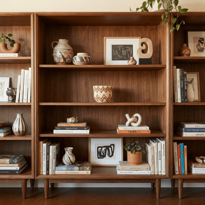 Decorative woven mini basket displayed on modern bookshelf with boho home decor styling