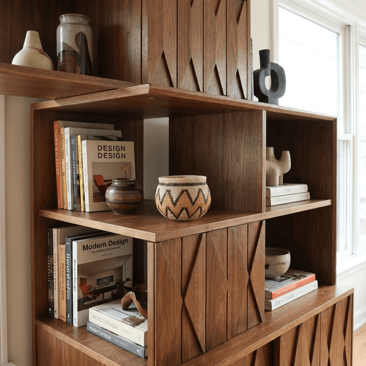 Decorative mini basket displayed on boho shelf with book modern home interior styling