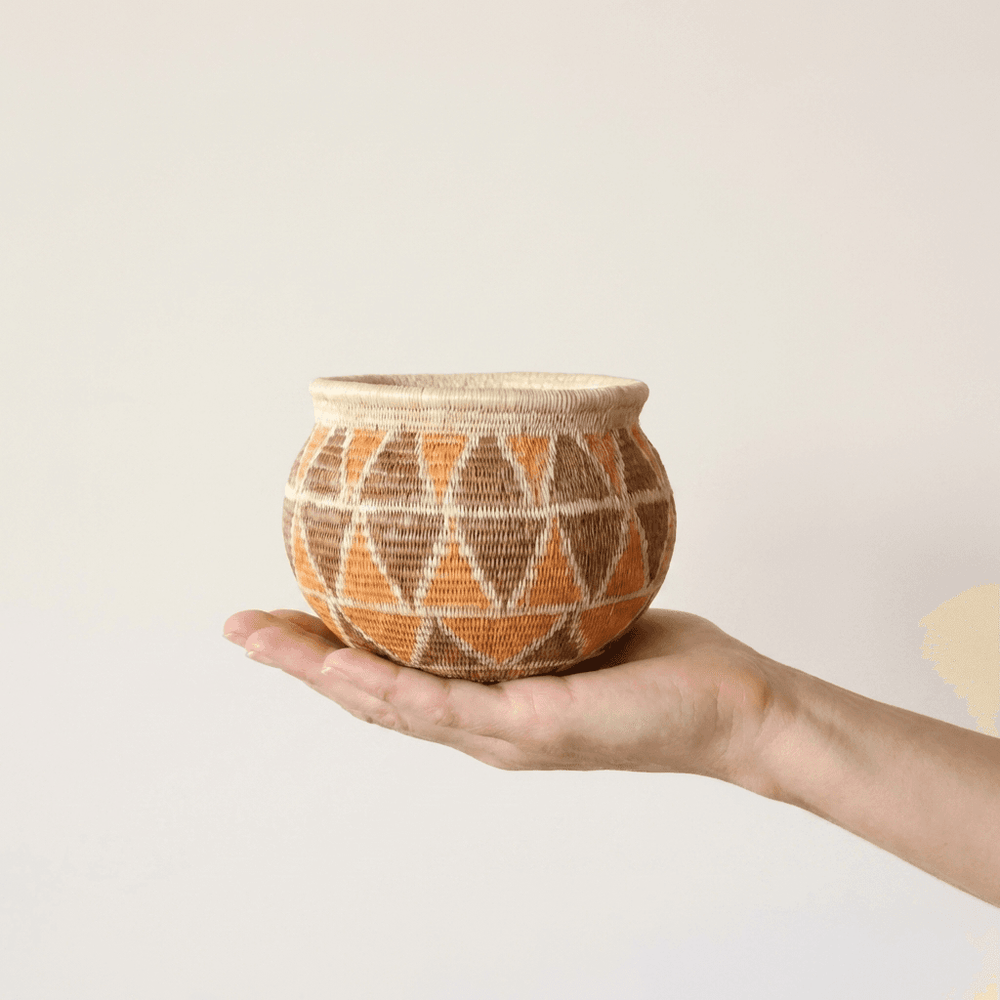 Small diamond pattern woven basket in vintage orange brown by Wounaan artisans from Panama rainforest