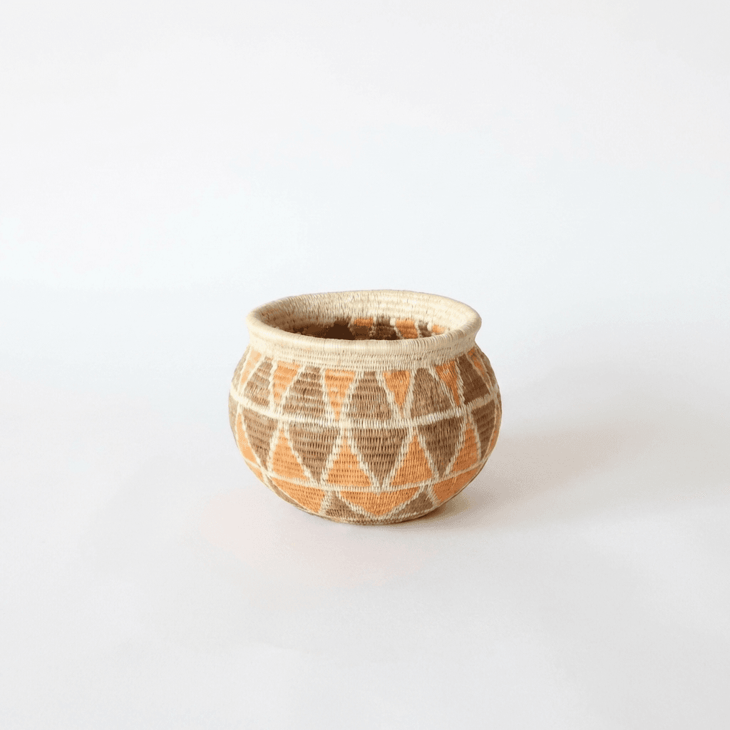 Small diamond pattern woven basket in vintage orange brown by Wounaan artisans from Panama rainforest