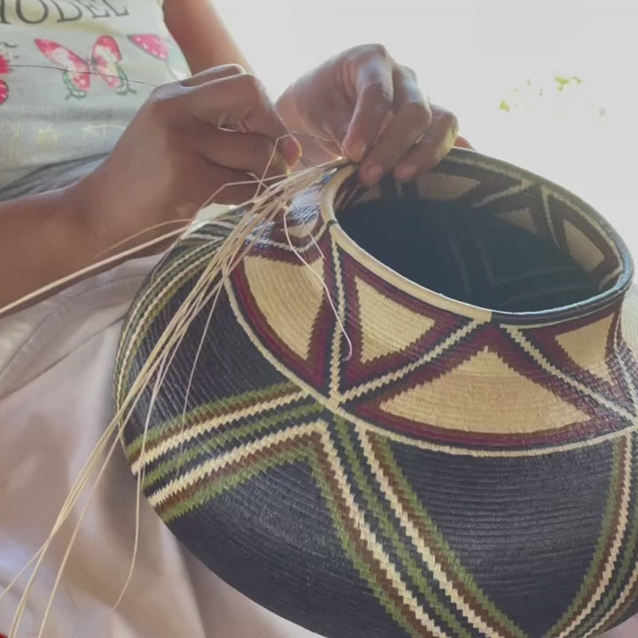 Side view of Panama handwoven basket showing dimensional depth and natural fiber craftsmanship