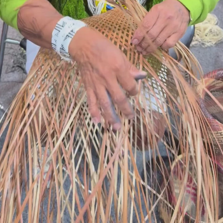 colombian artisan hands weaving basket