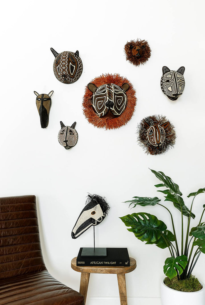 Forest guardian cat mask displayed as wall art in modern boho interior