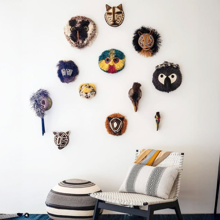 animal masks displayed as wall art in modern minimalist interior
